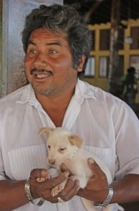 Man and White puppy