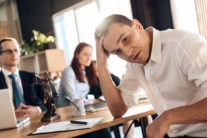 couple reviewing divorce agreement with attorney in Illinois