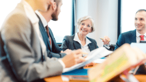 Couple reviewing an Illinois prenuptial agreement with their attorney