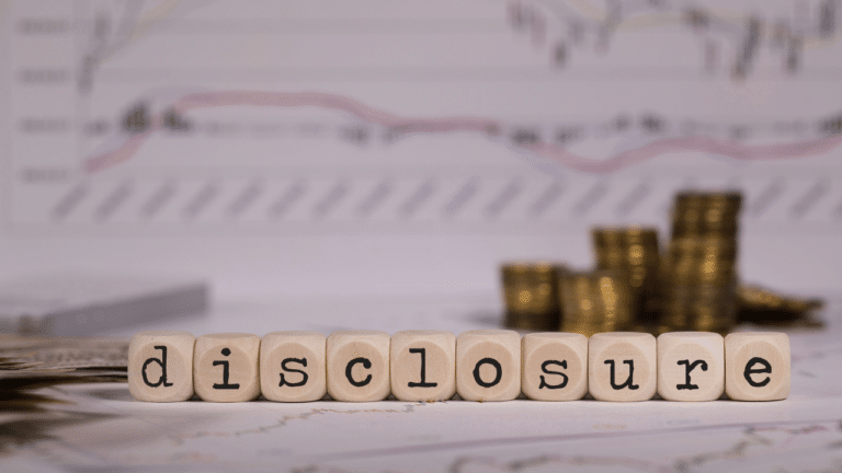 Financial disclosure with coins and stock market charts
