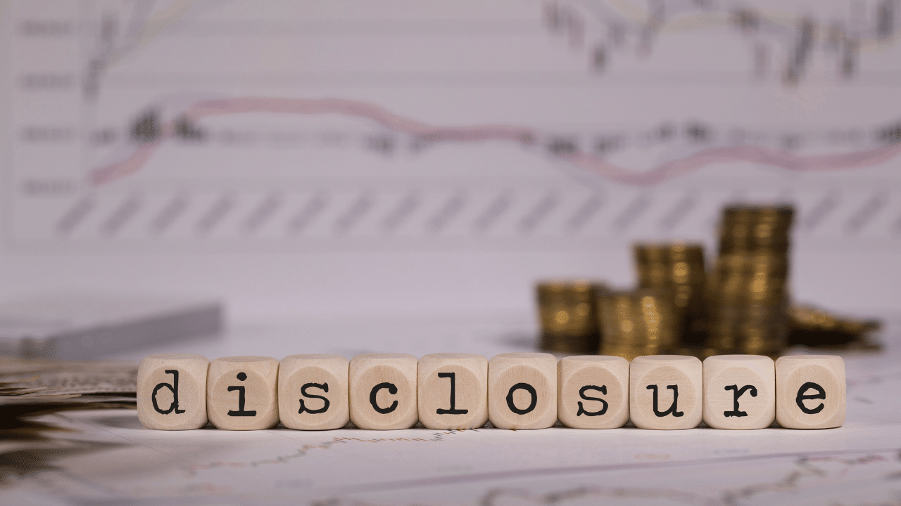 Financial disclosure with coins and stock market charts